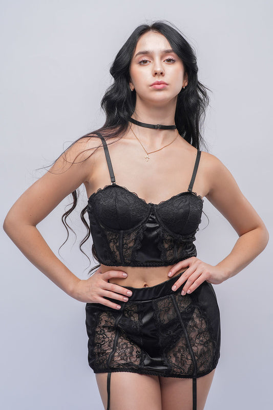 Black lace lingerie set with padded bralette and garter mini skirt, perfect for Indian honeymoon nightwear and romantic bedroom wear