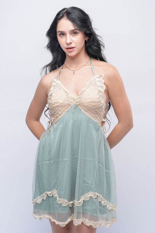 Woman in green babydoll nightdress with beige lace bust, stylish honeymoon lingerie for brides.
