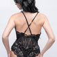 Back view of black lace teddy bodysuit with crisscross straps, designed for date nights and bridal lingerie