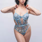 Sheer blue teddy bodysuit with lace embroidery, dreamy lingerie for anniversaries, bridal wear or date nights.