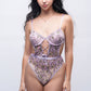 Sheer purple teddy bodysuit with floral embroidery, perfect for honeymoon nightwear or romantic bedroom look.