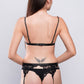 Back view of black lace lingerie with garter straps, bold and alluring bedroom lingerie.