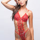 A woman models a stunning red teddy bodysuit with floral embroidery and elegant chain details. Ideal for romantic occasions and special nights.