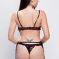 Back view of black lace lingerie with red rose embroidery and strappy garters, designed for seductive bedroom looks.