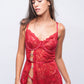Woman in red lace babydoll dress with heart cutouts, perfect for date nights and romantic bedroom wear