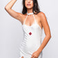 Woman in sexy white nurse costume with red cross hat, perfect for fantasy roleplay or bedroom cosplay.