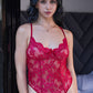 Front view of red lace teddy bodysuit featuring scalloped lace trim and delicate bow detail.