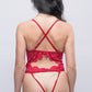 Back view of red lace teddy bodysuit with crisscross straps and open lace cut design.