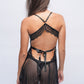 Back view of black lace babydoll lingerie with ribbon tie, sexy bedroom wear.