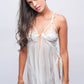 Sheer white lace babydoll lingerie with delicate straps, ideal for bridal nightwear.