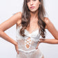 White lace teddy bodysuit with bow front and cutouts, elegant honeymoon or bridal lingerie.
