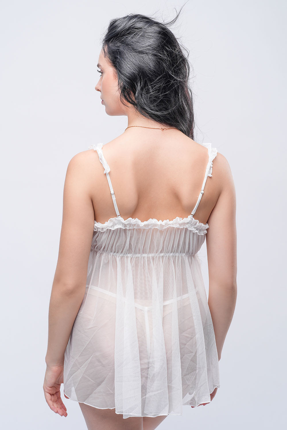 Back view of transparent white babydoll dress with ruffled straps, sensual lingerie for intimate nights