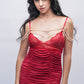 Woman in red lace ruched babydoll dress with pearl straps, perfect for romantic date night or bedroom wear.