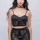Front view of black lace lingerie set with underwired bralette and sheer garter skirt, perfect for honeymoon nightwear in India
