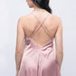 Back view of peach satin babydoll with cross straps, intimate wear for bedroom style.