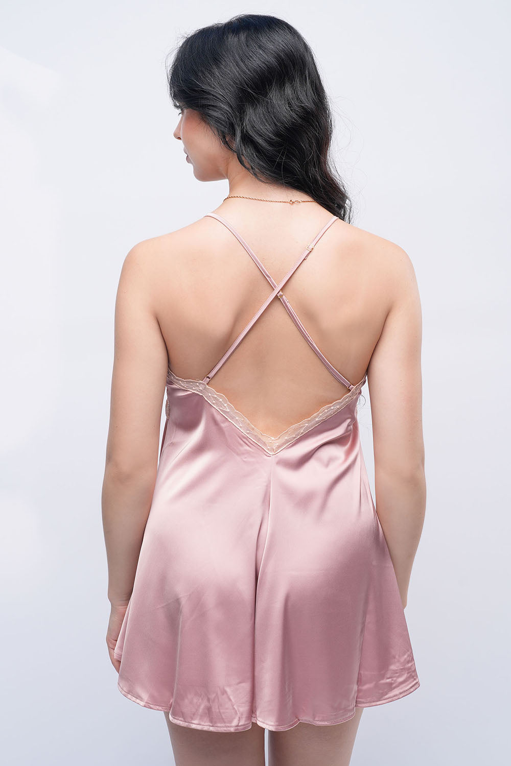 Back view of peach satin babydoll with cross straps, intimate wear for bedroom style.