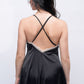 Back view of black satin babydoll with cross straps, sexy nightwear for date nights.