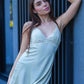 Woman posing in LIGHT GREEN satin lace babydoll slip, intimate nightwear and bedroom roleplay costume ideal for anniversaries, date nights, and honeymoon evenings.