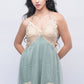 Woman in green babydoll nightdress with beige lace bust, stylish honeymoon lingerie for brides.