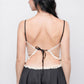 Back view of black satin babydoll dress with lace tie-up, sexy lingerie for valentine’s night.