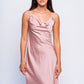 Woman in pink satin babydoll dress with cowl neck, elegant nightwear for honeymoon or bedroom wear.