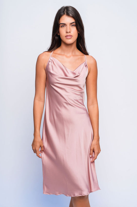 Woman in pink satin babydoll dress with cowl neck, elegant nightwear for honeymoon or bedroom wear.