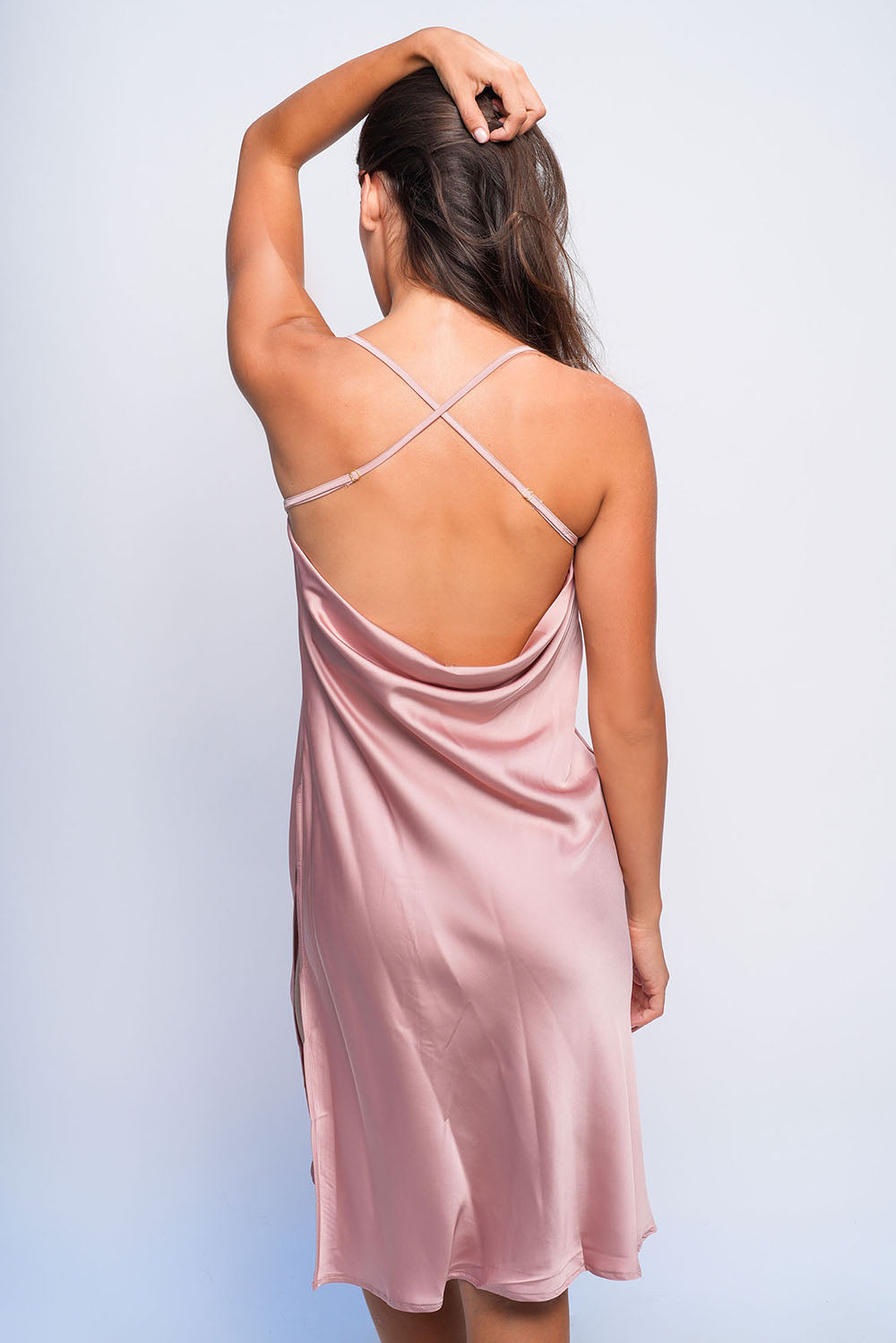 Back view of pink satin babydoll with cross straps, silky sleepwear perfect for romantic nights.