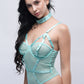 Woman in cyan strappy teddy bodysuit with satin choker, perfect for honeymoon or date night lingerie.